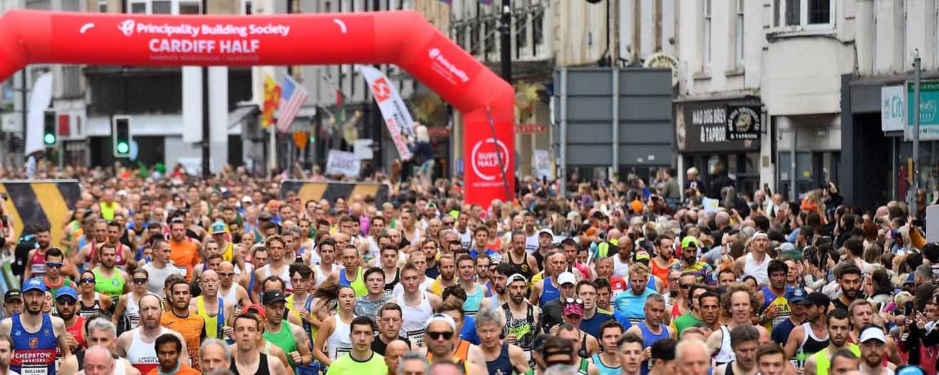 Runners setting off at the start of the Cardiff Half Marathon running event.